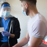 clinic worker showing card to patient