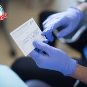 clinician holding vaccine card showing patient